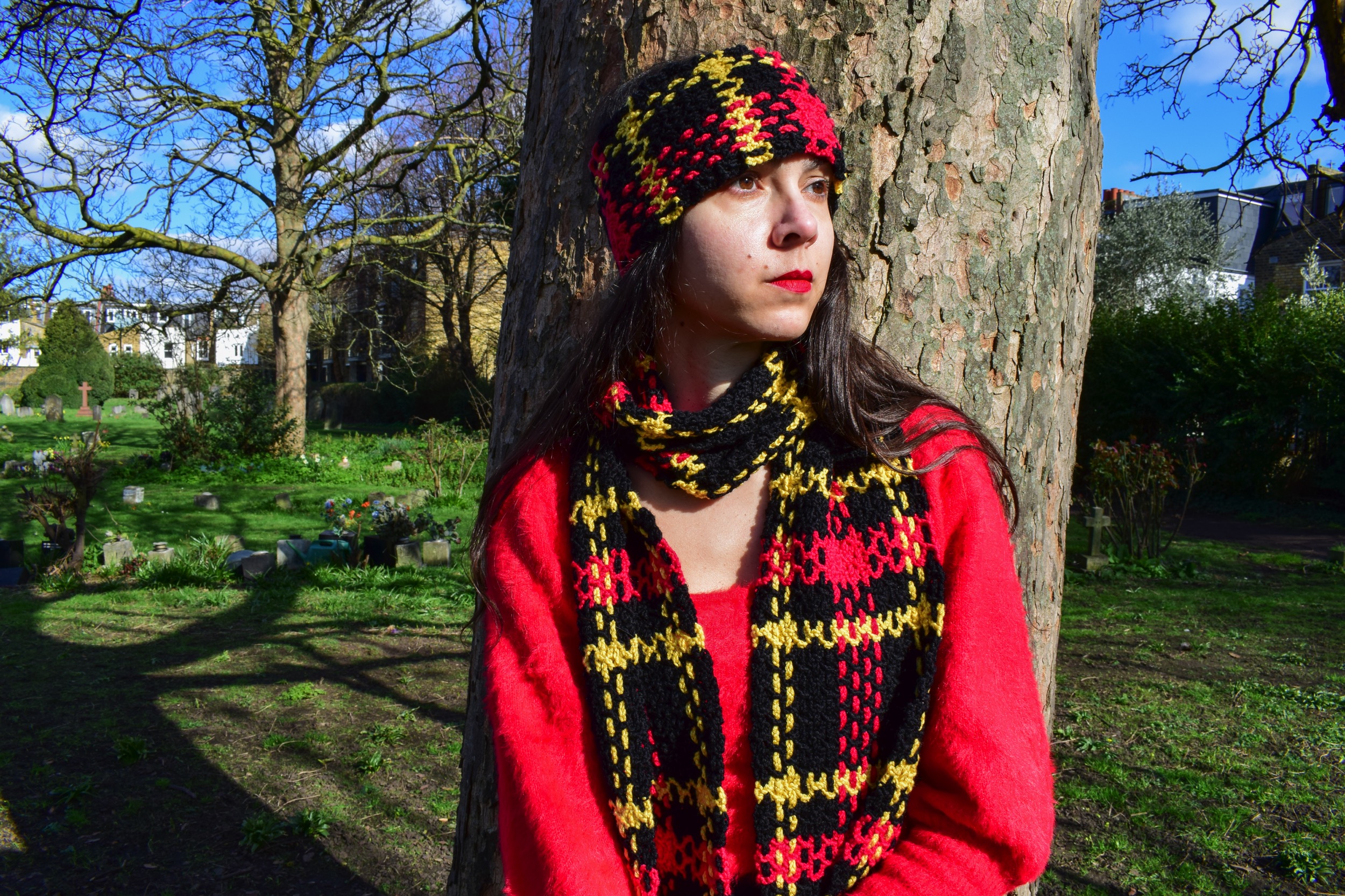 the picture links to a crochet project consisting of a tartan-effect scarf and matching headband